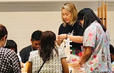 Sharing hand embroider skills and knowledges at Pung Caravan, Bangkok, Thailand.